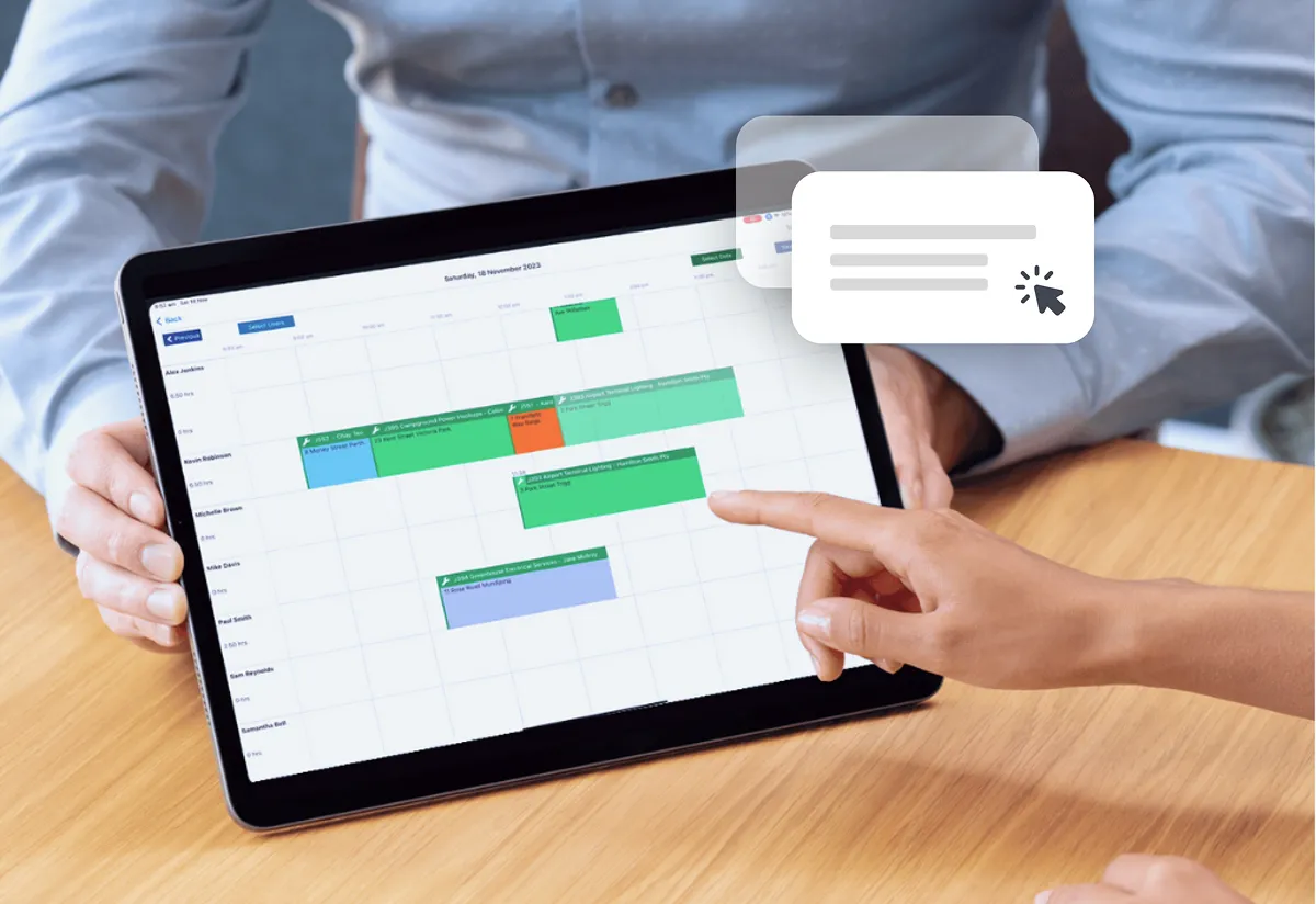 Person at a desk using a calendar and scheduling tool.